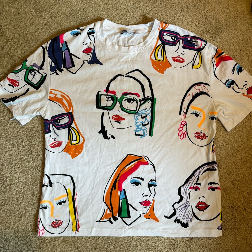 White Zara tee with fun, colorful faces. Worn once - excellent condition